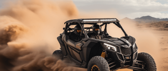 A black 4-seat side-by-side off-road vehicle driving through a desert landscape.