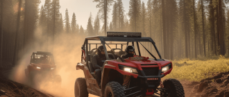 A red 5-seater side-by-side UTV driving down a dirt road through a forest.