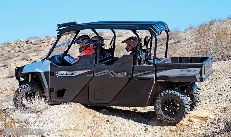 UTV Stampede XTR with one driver and two passengers on desert terrain